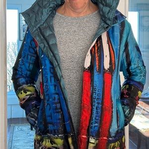 Neverworn fully reversible Ubu Clothing jacket. Lively urban pattern/dark aqua.